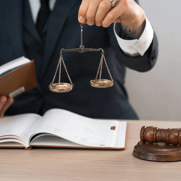 Judge sitting at wooden table working in office.