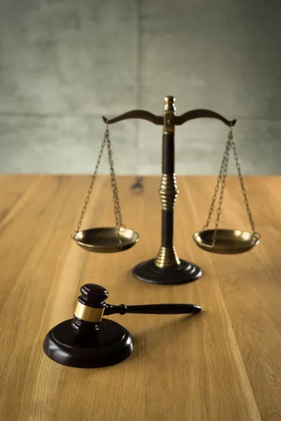 Law and Justice, judge gavel with scales on wooden table.