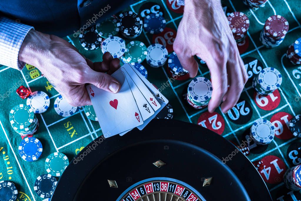 Man playing gambling games in casino, closeup.
