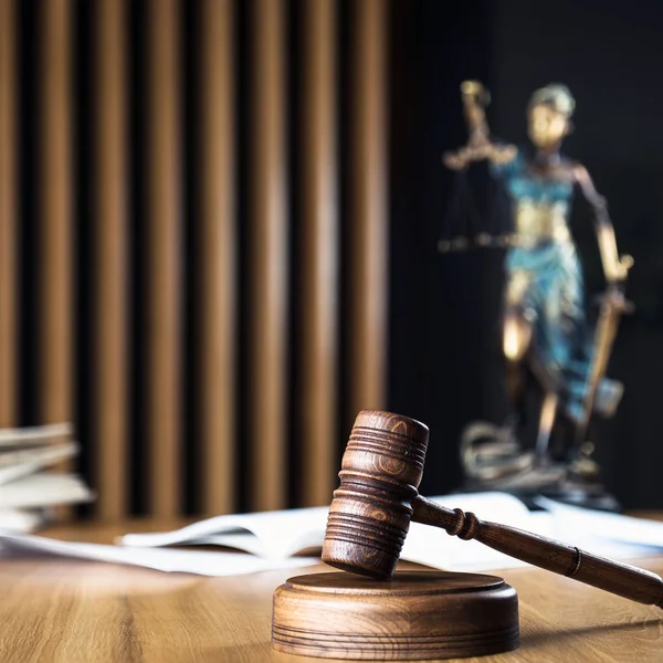 Law and Justice, judge gavel on wooden table with blurred background.