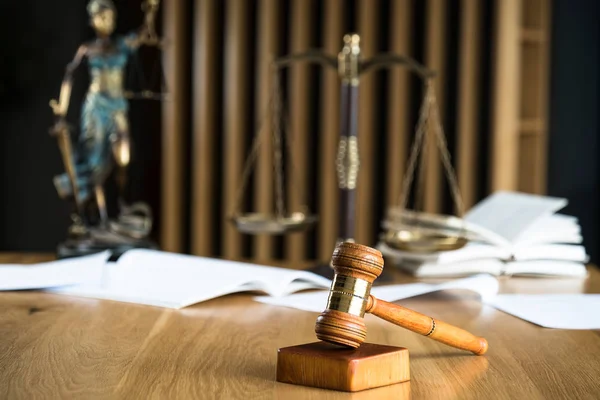 Law and Justice, judge gavel on wooden table with blurred background.