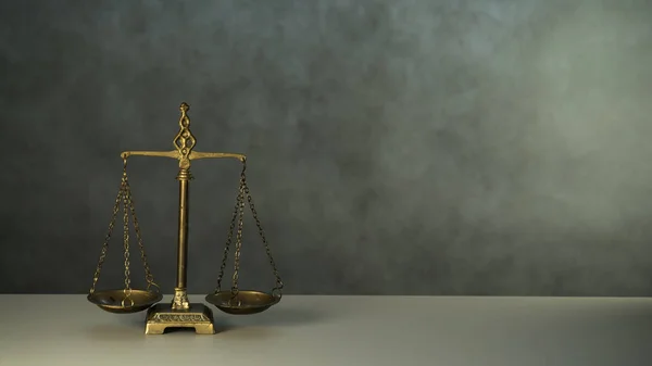 Law and Justice, scales on table with copy space background.