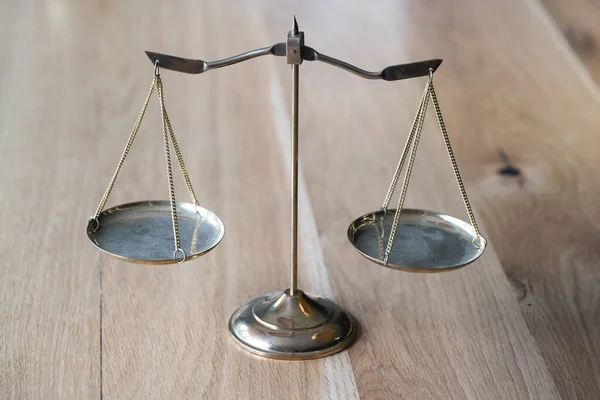 Closeup of balance scales, weight balance. Law and justice concept