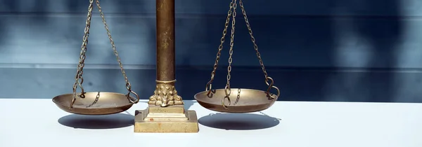 Closeup of balance scales, weight balance. Law and justice concept