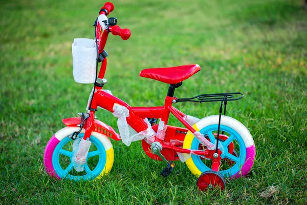 Child colorful bicycle with training wheels