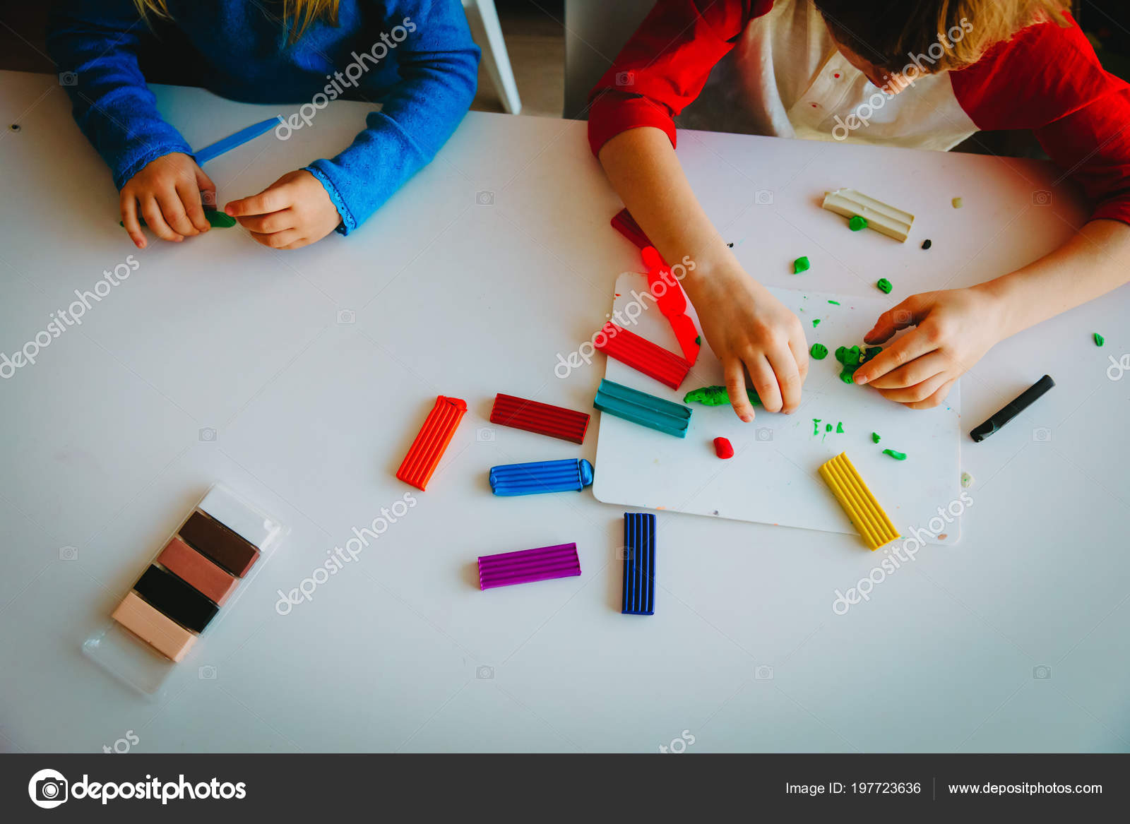 Kids playing with clay molding shapes Stock Photo by ©Nadezhda1906