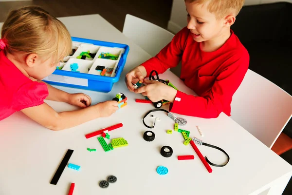 kids building robot at robotic technology school lesson