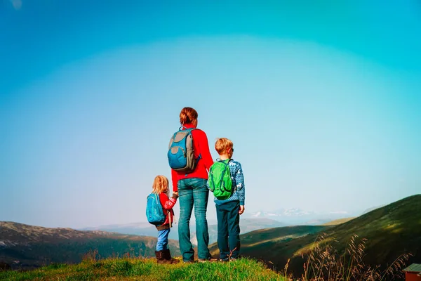 Mother with kids travel hiking in nature — Stock Photo, Image