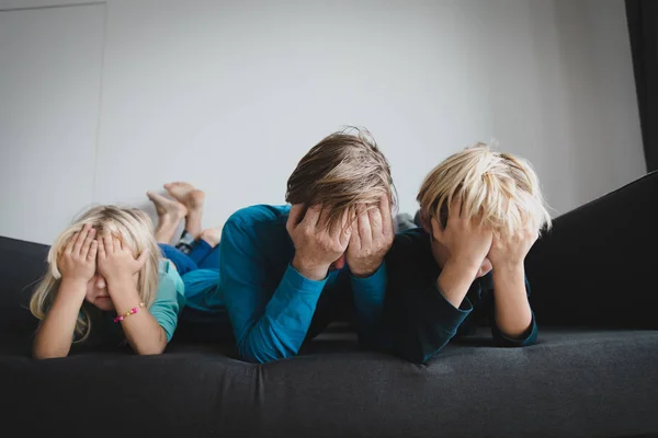 sad kids with stressed father, family in sorrow