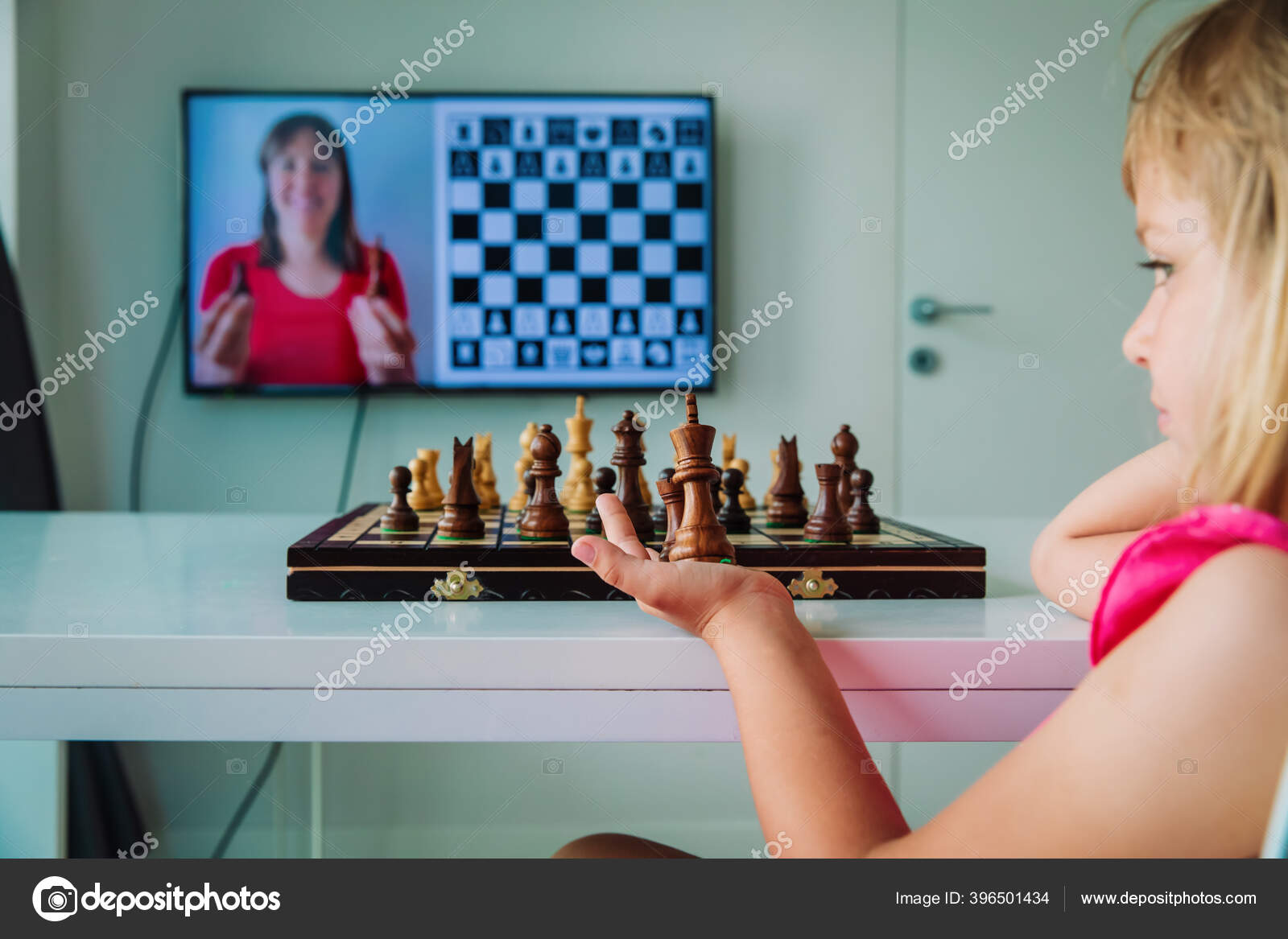 Playing chess online. Studying how to play chess online. Stock