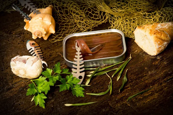 Salted anchovy fillets in olive oil tin can — Stock Photo, Image