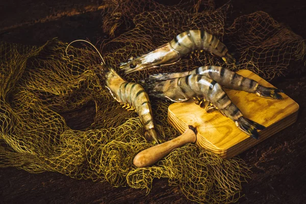 Raw tiger prawns, rustic background. — Stock Photo, Image