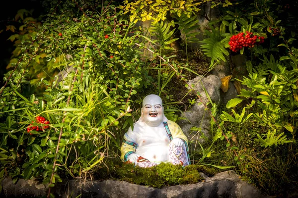 Laughing Buddha in the garden.