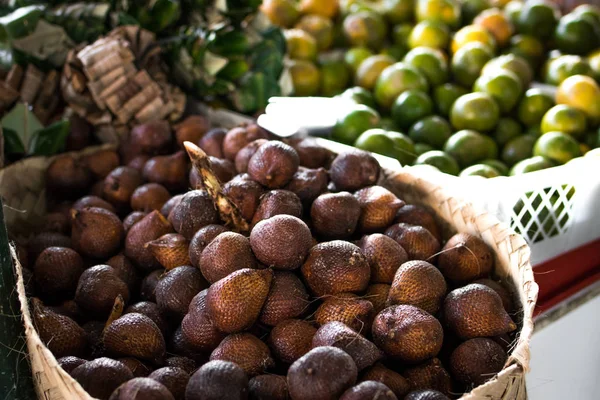 Tropical fruit, salak snake fruit on organic market in Asia.