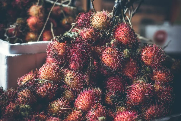 Rambutan fruits on the asian night market. Bali island. — Stock Photo, Image