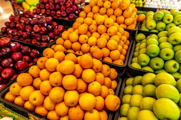 Fresh navel orange fruits pile for market place. Bali island, Indonesia.