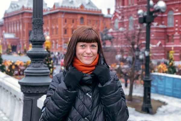 Young russian woman on a Red Square close to Kremlin. Moscow city.