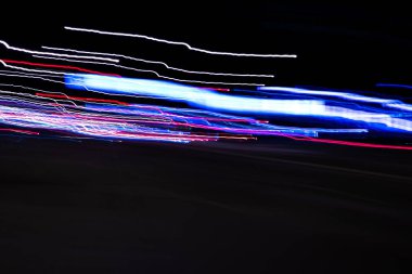 Gece şehir ışıkları arka plan, uzun pozlama. Soyut arka plan.