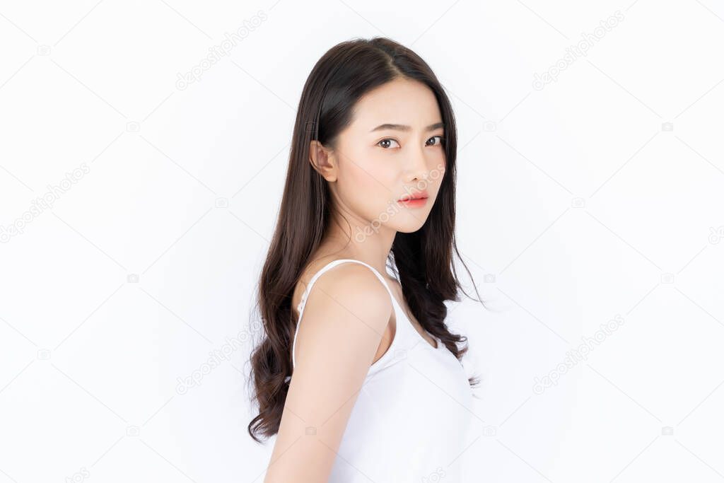 Young asian woman has smiling face and bright skin tone. Asian woman standing with isolated white background.