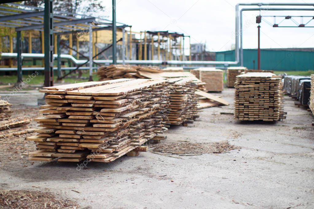 Woodworking industry. A pile of untreated wooden boards.Wood in production