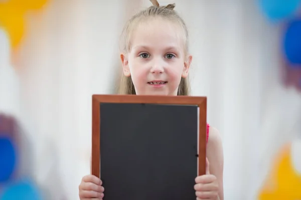 The girl is holding a graphic board