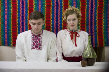 Belarus, Gomel, November 24, 2018. Reconstruction of an ethnic old Belarusian wedding.Slavic Belarusian or Ukrainian bride and groom. Woman and man in national embroidered shirts