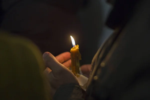 Candle in the hand of the believer