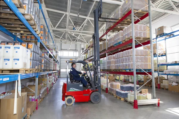 Belarus, the city of Mensk, April 12, 2019. Chemical production.Worker on a loader in a warehouse