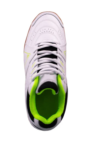 Witte sneaker met zwarte inzetstukken op een witte achtergrond. — Stockfoto