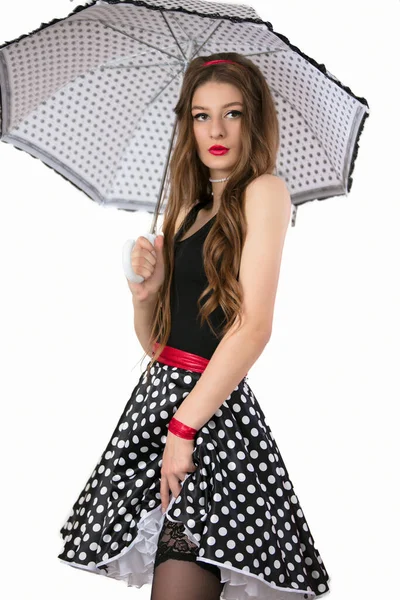 Schöne Mädchen mit einem Regenschirm auf weißem Hintergrund. Die Frau hält einen Regenschirm. — Stockfoto