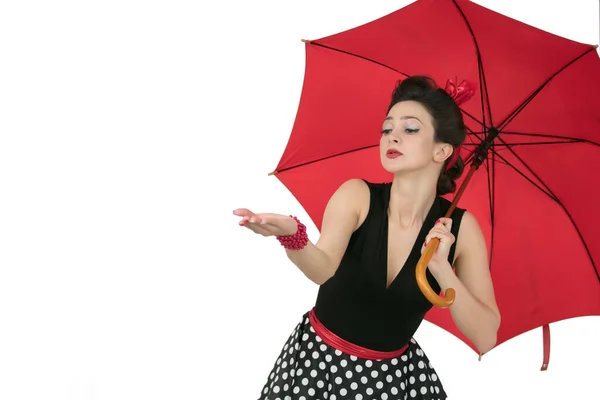 Retro woman in polka dot dress with red umbrella — Stock Photo, Image