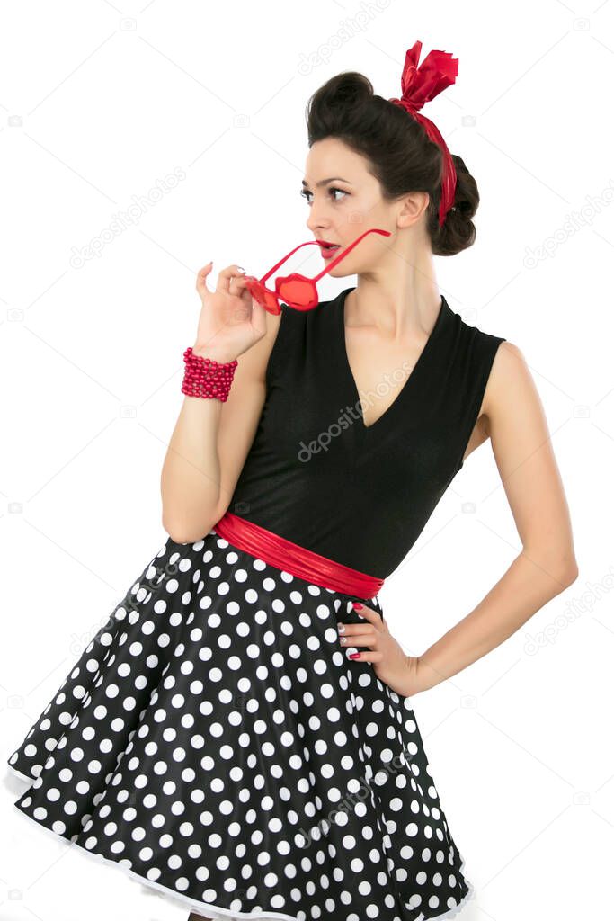 A woman in fifties-style clothes. Beautiful retro girl.