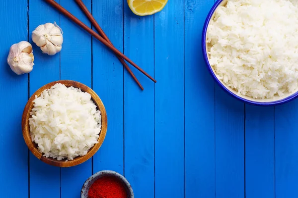 Bowls Cooked Jasmine Rice Chopsticks Blue Wooden Background — Stock Photo, Image