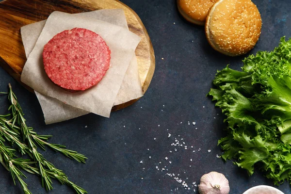 Classical american burger ingredients on dark blue background, concept of cooking burger — Stock Image Classical American Burger Ingredients Dark Blue Background Concept Cooking Burger Royalty Free Stock Images