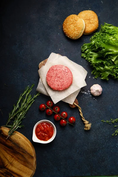 Classical american burger ingredients on dark blue background, concept of cooking burger — Stock Image Classical American Burger Ingredients Dark Blue Background Concept Cooking Burger Royalty Free Stock Photos