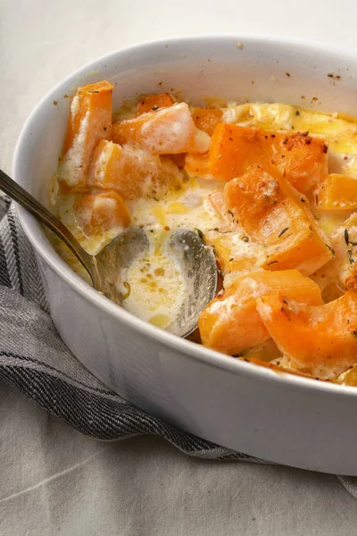 Roasted squash baked with heavy cream and thyme with white wine and parmesan cheese, close-up