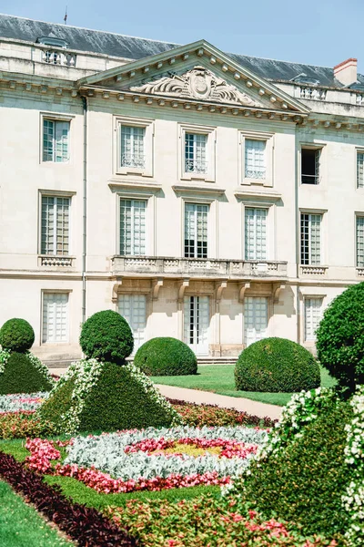 French traditional building with classical garden of geometrical forms, French architecture concept