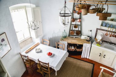 POITIERS, FRANCE - AUGUST 10 , 2018: Kitchen interior at the french chateau with old-fashioned utensils clipart