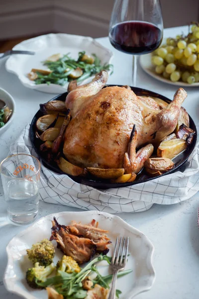 Big festive dinner with roasted chicken and wine with garnishing, Celebration concept