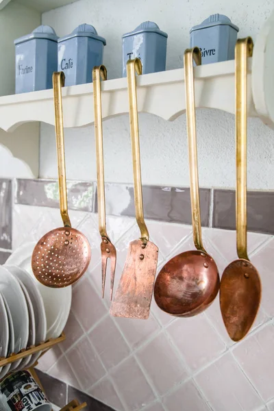 Copper Kitchen Utensils Spoons Spatulas Hanging Next Pink Tiles — Stock Photo, Image