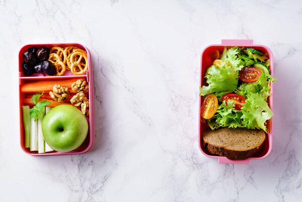 Lunch box with salad and healthy food for work and school 