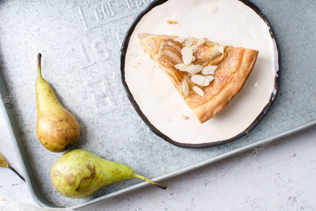 slice of tart with poached pears and almond frangipane 