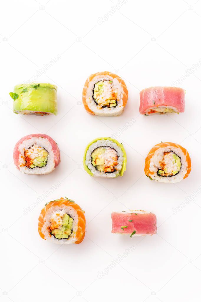 colorful sushi rolls with crab meat isolated on white background, close-up 