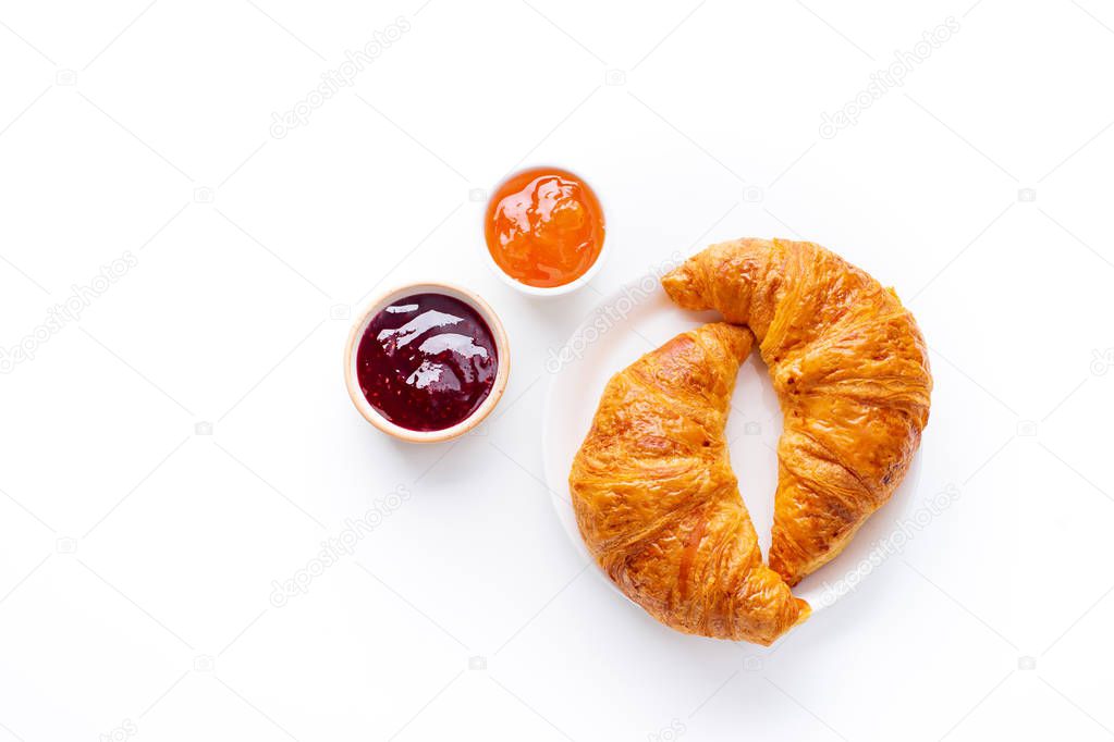 fresh croissants served with jams on white background. Morning meal concept