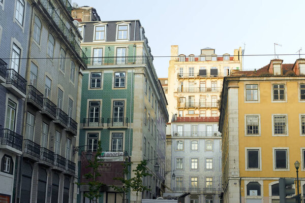 LISBON, PORTUGAL - SEPTEMBER 1, 2019: traditional buildings facades on the street in Lisbon historical center