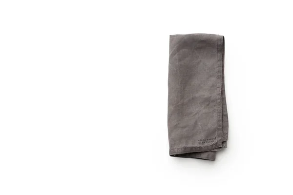 白色背景的折叠灰色亚麻布厨房餐巾 — 图库照片