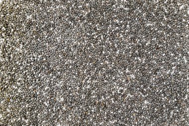 Doku arkaplanı olarak chia tohumunu kapat. Metin için alan, süper yiyecek konsepti. Chia tohumlarının üst görünümü