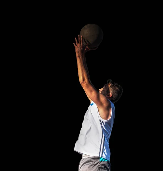 篮球运动员跳跃从右边被看见查出在黑色背景 — 图库照片