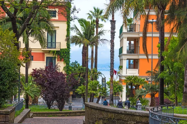 Palm trees and elegant buildings in Sorrento shore, Italy