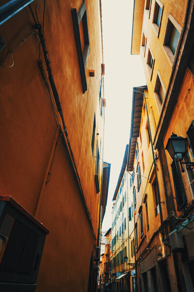 Narrow street in Pisa. Tuscany, Italy